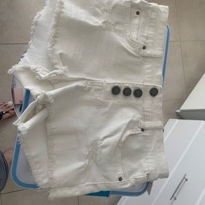 White ripped jean shorts